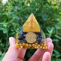 Orgone crystal pyramid with Flower of Life symbol and black tourmaline held in hand - 6cm / A31-Black Stone Flower of Life Spiral