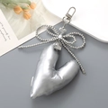Minimalist silver 3D heart-shaped PU leather keychain with metallic bow and bead chain - Silver