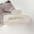 Detail of a large rectangular white hair claw with a subtle marble texture on a white background - 10.5cm Rectangular / Starry Cream