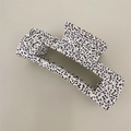 Detail view of large rectangular hair claw clip with black and white speckled pattern - Large Rectangle / White