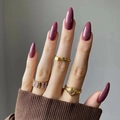 Long almond press-on nails in glossy dusty rose with elegant gold jewelry detail - Dusty Rose (JP2134)