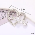 Silver heart-shaped rhinestone brooch with center pearl measuring 3.5cm by 2.5cm - Silver Heart (D2308)