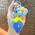 Handmade crochet strawberry and flower keychain in light blue yarn with matching plastic clip - Blue Strawberry Flower
