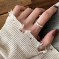Close-up of a minimalist 925 sterling silver open ring on a model's finger - JZ0842-Silver Smooth