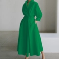 Detail van groene lange jurk met lange mouwen, V-hals, getailleerde vorm en knoopsluiting - S / Onderkant (5082#) / Groen