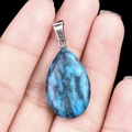 Blue and black water drop crystal stone pendant with silver clasp in hand view - Blue Crazy Lace (1pc)