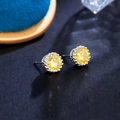 Macro shot of 8mm yellow cubic zirconia earrings in a silver crown-shaped setting - Golden Yellow 8MM