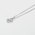 Minimalist silver necklace featuring letter S pendant with hexagonal honeycomb texture - Letter S / Silver
