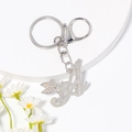 Zilveren letter A sleutelhanger met feeënvleugels en strass op een wit dienblad - Stijl A / Zilver