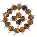 Natural heart-shaped tiger eye stone pendants with silver metallic clips in spiral display - Tiger's Eye