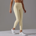 High-waist light yellow yoga pants featuring a seamless front and squat-proof fabric - Light Apricot