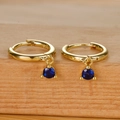 S925 sterling silver hoop earrings with dark blue gemstone pendants on a wood surface - Gold Blue Zircon
