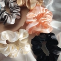 Assorted silk scrunchies in gold, silver, pink, and black on a stone and silk backdrop - Orange Pink 3.5cm