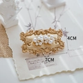 Floral pearl earrings on a vintage gold stand with retro decor and 4cm/7cm size markers - Gold Earring Display Plate