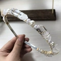 Close-up of handmade crown headband featuring natural crystals and white pearls with gold wire - Clear Quartz Gold Wire Silver Headband