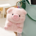Cute pink plush pig keychain for bags featuring a soft fluffy texture and golden metal clasp - Pink Pig