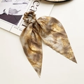Golden leopard print silk scrunchie with long ribbon on lifestyle magazine background - 9# Golden Brown Texture