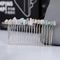 Macro shot of handmade hair comb featuring natural crystal stones and silver metal teeth - Morganite + 20-Tooth Silver Comb