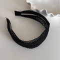 Close-up of the woven texture on a black braided wide headband with minimalist design - Black