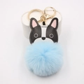 Detail of cute bulldog pendant with light blue fluffy pom pom and golden metal keychain - Light Blue