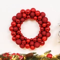 Red Christmas ball wreath with matte and glitter finishes on a festive pine background - 35CM Christmas Ball Wreath - Red