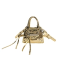 Glossy golden metallic mini crossbody bag with rivets and long tassels on white background - Gold