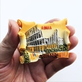 Close-up of a resin souvenir magnet featuring the Colosseum and ROMA text - Rome Scroll