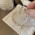 Detail of S925 sterling silver heart charm and lucky tag on natural pearl bracelet - Lucky Heart Artificial Pearl (SL0980)