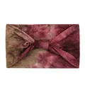 Detail view of the soft tie-dye elastic headband with a stylish twist knot design - Tie-Dye Red Brown