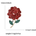 Elegant rose brooch with red and green crystals on a gold stem, dimensions 5x3.1cm - Red 0243-RD