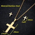 Golden stainless steel cross jewelry set with necklace and earrings on black background - Cross / Gold