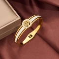 Macro detail of gold tree of life bangle with double-row zircon pavé on silk - Gold