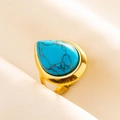 Macro detail of a pear-shaped turquoise stone with black veins on a gold adjustable ring - Gold Base Dark Blue Stone (J535-G-DB)