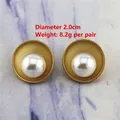 Detail view of vintage matte gold pearl earrings with 2.0cm diameter and 8.2g weight - 0335/Gold Concave Disc Pearl Studs