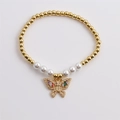 Elegant gold beaded bracelet with white pearls and a colorful gemstone butterfly charm - Multicolor Zirconia Butterfly Pendant Style