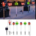 Estacas solares navideñas de jardín con Papá Noel y cajas de regalo de colores - Santa con Regalos / Modelo de Batería Impermeable