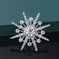 Silver starburst brooch with sparkling crystals on dark reflective surface - Silver Radiant Star (XD7996-1)