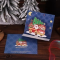 Detailed view of 3D Christmas pop-up card featuring Santa and reindeer on a wooden table - Christmas Car