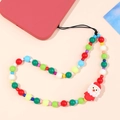 Detailed view of colorful beads and Santa Claus pendant on a holiday phone strap - K1642 Santa Claus Beaded Style