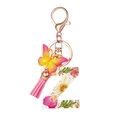 Resin letter Z keychain with dried pink flowers, butterfly charm and pink tassel - Flower Pattern Z