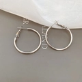 Flat lay of minimalist silver hoop earrings on grey background with white gauze - 3cm / Silver