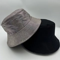 Detail showing two bucket hats in shiny silver laser finish and classic matte black cotton - Silver Metallic Texture 2-Piece Set (11)