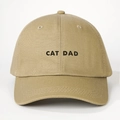 Macro detail of high-density cotton twill fabric and CAT DAD embroidery on khaki baseball cap - CAT DAD Embroidery / Khaki