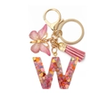Pink resin alphabet W keychain with colorful heart sequins, butterfly charm and tassel - Letter W