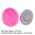Pink oval silicone mold with portrait relief and gray gypsum pendant for DIY crafts - Pink