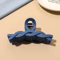 Detailed view of large matte blue hair claw clip with wave texture and metal spring - Dark Blue Matte-Twist