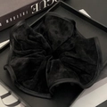 Chic black polka dot velvet scrunchie displayed on a stylish leather tray - Black Polka Dot
