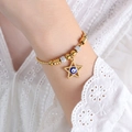 Gold beaded bracelet with evil eye star pendant worn over white lace fabric - E455-Blue Enamel Gold Color Bracelet