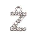 Macro shot of silver metal Z-letter pendant with pavé set white zircon stones - Letter Z
