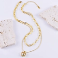 Double-layered golden necklace featuring a butterfly pendant and paperclip chain style - Butterfly